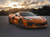 2023-chevrolet-corvette-z06-coupe-with-z07-performance-package-amplify-orange-tintcoat-exterior-001-front-three-quarters-carbon-fiber-front-splitter-and-dive-planes-carbon-fiber-wheels