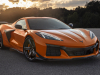 2023-chevrolet-corvette-z06-coupe-with-z07-performance-package-amplify-orange-tintcoat-exterior-002-front-three-quarters-carbon-fiber-front-splitter-and-dive-planes-carbon-fiber-wheels