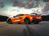 2023-chevrolet-corvette-z06-coupe-with-z07-performance-package-amplify-orange-tintcoat-exterior-003-rear-three-quarters-rear-three-quarters-carbon-fiber-high-wing-spoiler-carbon-fiber-wheels