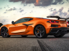 2023-chevrolet-corvette-z06-coupe-with-z07-performance-package-amplify-orange-tintcoat-exterior-004-rear-three-quarters-carbon-fiber-high-wing-spoiler-carbon-fiber-wheels