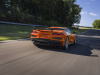 2023-chevrolet-corvette-z06-coupe-with-z07-performance-package-amplify-orange-tintcoat-exterior-005-rear-three-quarters-carbon-fiber-high-wing-spoiler