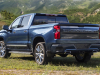 2022-chevrolet-silverado-1500-refresh-high-country-exterior-007-rear-three-quarter-dual-exhaust-tail-lamps-tailgate