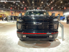 2022-chevy-silverado-3500hd-hoonigan-concept-2021-sema-exterior-002-front-chrome-grille-painted-black-black-chevy-bow-tie-logo-tow-hooks-fog-lights