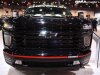 2022-chevy-silverado-3500hd-hoonigan-concept-2021-sema-exterior-013-front-chrome-grille-painted-black-black-chevy-bow-tie-logo-tow-hooks-accent-lights-headlights-fog-lights