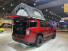 2022-chevrolet-tahoe-z71-overlanding-concept-2021-sema-live-photos-exterior-009-rear-three-quarters-freespirit-recreation-high-country-80-inch-premium-tent-liftgate-open-dometic-cooler