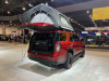 2022-chevrolet-tahoe-z71-overlanding-concept-2021-sema-live-photos-exterior-010-rear-three-quarters-freespirit-recreation-high-country-80-inch-premium-tent-liftgate-open-dometic-cooler