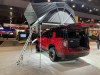 2022-chevrolet-tahoe-z71-overlanding-concept-2021-sema-live-photos-exterior-012-rear-three-quarters-freespirit-recreation-high-country-80-inch-premium-tent-liftgate-open-dometic-cooler