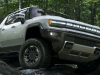 2022-gmc-hummer-ev-pickup-edition-1-exterior-006-front-three-quarters-forest