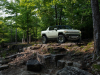 2022-gmc-hummer-ev-pickup-edition-1-exterior-009-front-three-quarters-forest