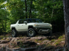 2022-gmc-hummer-ev-pickup-edition-1-exterior-010-front-three-quarters-forest