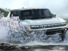 2022-gmc-hummer-ev-pickup-edition-1-exterior-019-front-three-quarters-driving-through-water