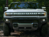 2022-gmc-hummer-ev-pickup-edition-1-exterior-044-front-end-forest-hummer-ev-logo-script-on-grille