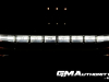 2022-gmc-hummer-ev-pickup-edition-1-gma-garage-exterior-at-night-013-front-drl-daytime-running-light-bar-with-hummer-logo-side-marker-lights
