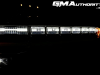 2022-gmc-hummer-ev-pickup-edition-1-gma-garage-exterior-at-night-017-drl-daytime-running-light-bar-with-hummer-logo-side-marker-lights-headlights