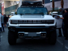 2022-gmc-hummer-ev-pickup-edition-1-with-official-accessories-2021-sema-live-photos-exterior-003-front-grille-with-hummer-logo-lettering-headlights