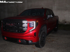 2022-gmc-sierra-1500-at4x-cayenne-red-tintcoat-gma-garage-may-2022-exterior-003-front-three-quarters-gmc-logo-grille-red-tow-recovery-hooks
