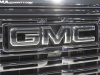2022-gmc-sierra-denali-ultimate-1500-quicksilver-metallic-gan-2022-cas-exterior-018-front-vader-chrome-gmc-logo-and-grille