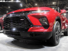 2023-chevrolet-blazer-rs-radiant-red-2022-chicago-auto-show-live-photos-exterior-011-front-detail-grille-led-daytime-running-light-led-headlight-black-chevy-badge-logo-red-rs-badge-logo