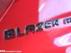 2023-chevrolet-blazer-rs-radiant-red-2022-chicago-auto-show-live-photos-exterior-036-black-blazer-logo-script-on-hatch