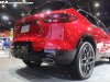 2023-chevrolet-blazer-rs-radiant-red-2022-chicago-auto-show-live-photos-exterior-038-rear-three-quarters-exhaust-tail-lights-hatch-door-lower-rear-fascia-wheels