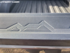 2023-chevrolet-colorado-first-drive-tailgate-004-mountains-decor-on-top-lip