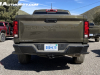 2023-chevrolet-colorado-trail-boss-harvest-bronze-metallic-gxn-first-drive-exterior-004-rear-chevrolet-debossed-in-tailgate-tail-lights