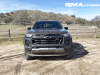 2023-chevrolet-colorado-trail-boss-harvest-bronze-metallic-gxn-first-drive-exterior-010-front-front-fascia-headlights-black-chevy-bowtie-logo-badge-on-grille