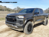 2023-chevrolet-colorado-trail-boss-harvest-bronze-metallic-gxn-first-drive-exterior-013-side-front-three-quarters
