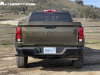 2023-chevrolet-colorado-trail-boss-harvest-bronze-metallic-gxn-first-drive-exterior-022-rear-debossed-chevrolet-script-on-tailgate-tail-lights