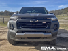 2023-chevrolet-colorado-trail-boss-harvest-bronze-metallic-gxn-first-drive-exterior-026-front-front-fascia-headlights-black-chevy-bowtie-logo-badge-on-grille