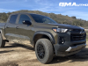 2023-chevrolet-colorado-trail-boss-harvest-bronze-metallic-gxn-first-drive-exterior-027-side-front-three-quarters