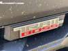 2023-chevrolet-colorado-trail-boss-harvest-bronze-metallic-gxn-first-drive-exterior-036-trail-boss-logo-badge-on-grille