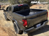 2023-chevrolet-colorado-trail-boss-harvest-bronze-metallic-gxn-offroad-first-drive-exterior-003-rear-three-quarters-bed_0