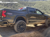 2023-chevrolet-colorado-trail-boss-harvest-bronze-metallic-gxn-offroad-first-drive-exterior-006-side-taillights-cornerstep-bumper-spare-tire-exhaust