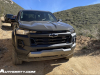 2023-chevrolet-colorado-trail-boss-harvest-bronze-metallic-gxn-offroad-first-drive-exterior-007-front-incandescent-headlights-black-chevy-logo-grille