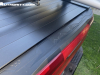 2023-chevrolet-colorado-trail-boss-radiant-red-tintcoat-gnt-first-drive-exterior-011-stowflex-tailgate-mountain-decor-tonneau-cover