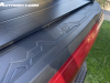 2023-chevrolet-colorado-trail-boss-radiant-red-tintcoat-gnt-first-drive-exterior-012-stowflex-tailgate-mountain-decor-tonneau-cover