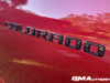 2023-chevrolet-colorado-trail-boss-radiant-red-tintcoat-gnt-first-drive-exterior-031-black-colorado-logo-badge-on-door