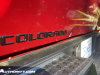 2023-chevrolet-colorado-trail-boss-radiant-red-tintcoat-gnt-first-drive-exterior-032-black-colorado-logo-badge-on-tailgate