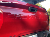 2023-chevrolet-colorado-trail-boss-radiant-red-tintcoat-gnt-first-drive-exterior-033-chevrolet-script-debossed-on-tailgate