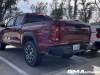 2023-chevrolet-colorado-z71-radiant-red-tintcoat-gnt-first-drive-march-2023-exterior-004-rear-three-quarters