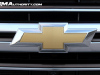 2023-chevrolet-suburban-gma-garage-high-country-lm2-duramax-diesel-silver-sage-metallic-g6n-exterior-075-gold-chevy-bowtie-logo-on-grille