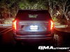 2023-chevrolet-suburban-high-country-gma-garage-night-time-lights-exterior-020-rear-tail-lights