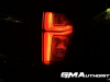 2023-chevrolet-suburban-high-country-gma-garage-night-time-lights-exterior-024-tail-light-signature-graphic
