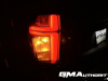 2023-chevrolet-suburban-high-country-gma-garage-night-time-lights-exterior-027-tail-light-turn-signal