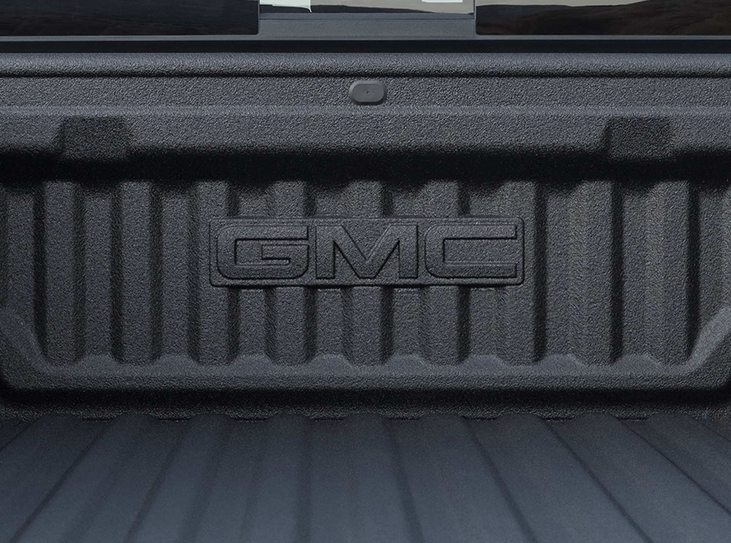 2023-gmc-canyon-at4-exterior-013-bulk-head-bed-liner-gmc-logo