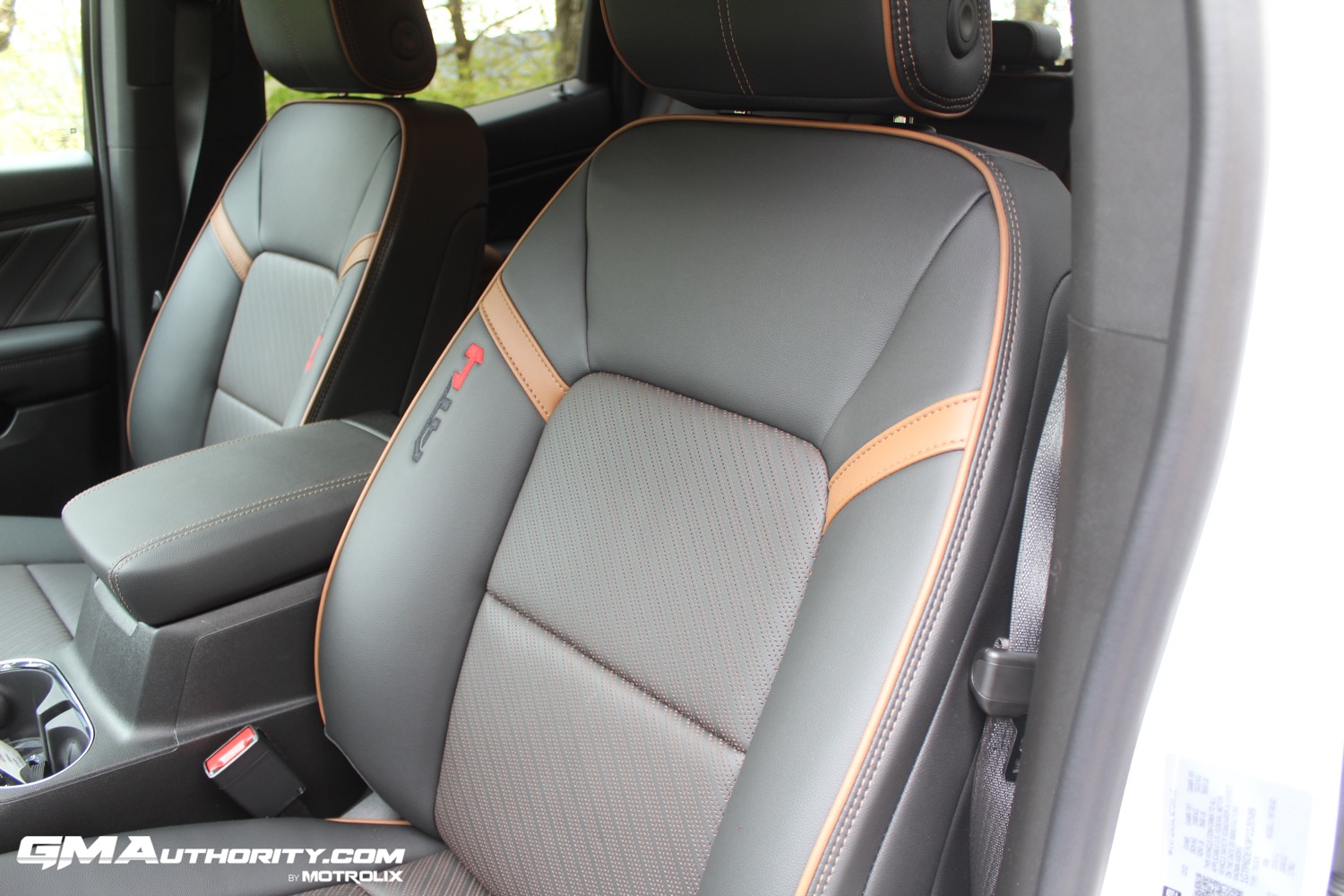 2023-gmc-canyon-at4-jet-black-with-timber-hx6-first-drive-interior-008-driver-seat-detail