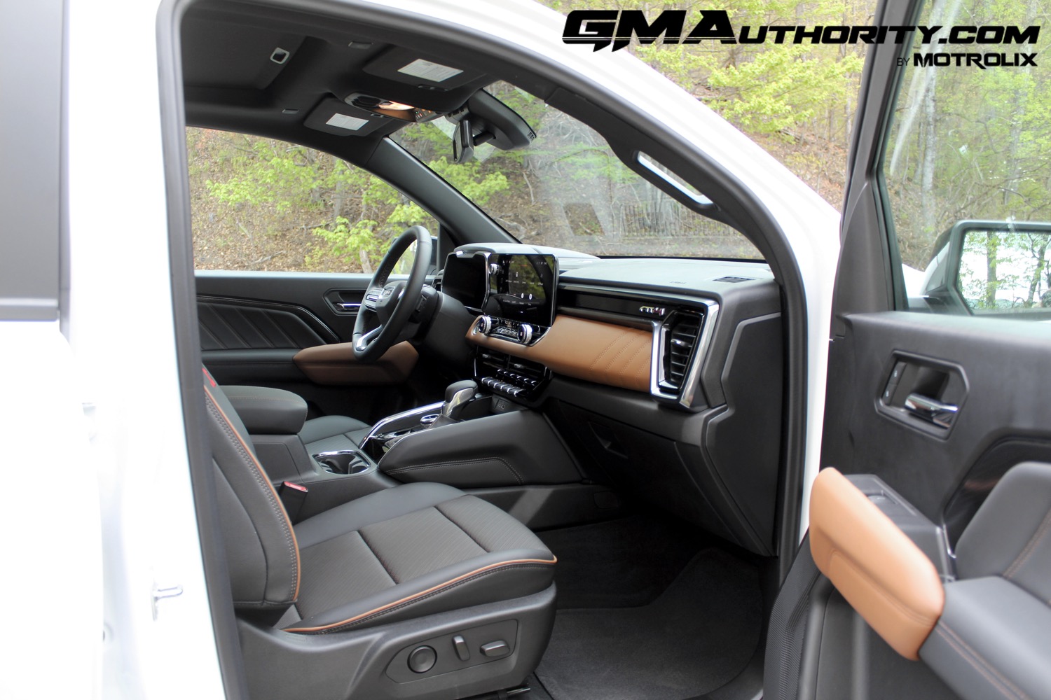 2023-gmc-canyon-at4-jet-black-with-timber-hx6-first-drive-interior-017-front-passenger-seat-dash