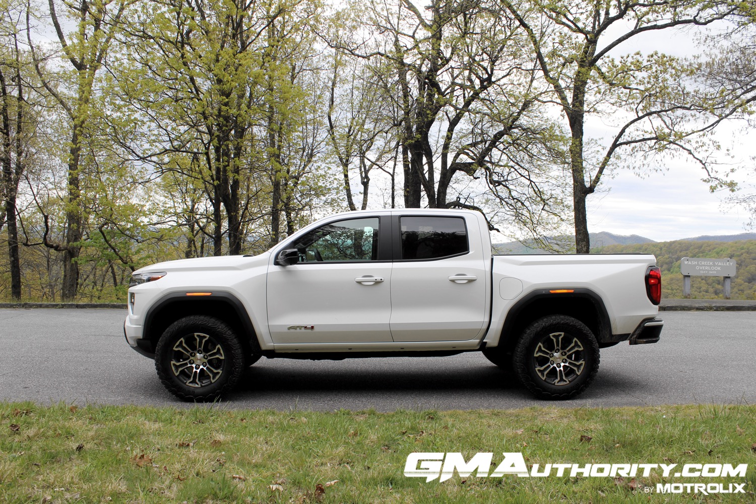 2023-gmc-canyon-at4-summit-white-gaz-first-drive-exterior-007-side