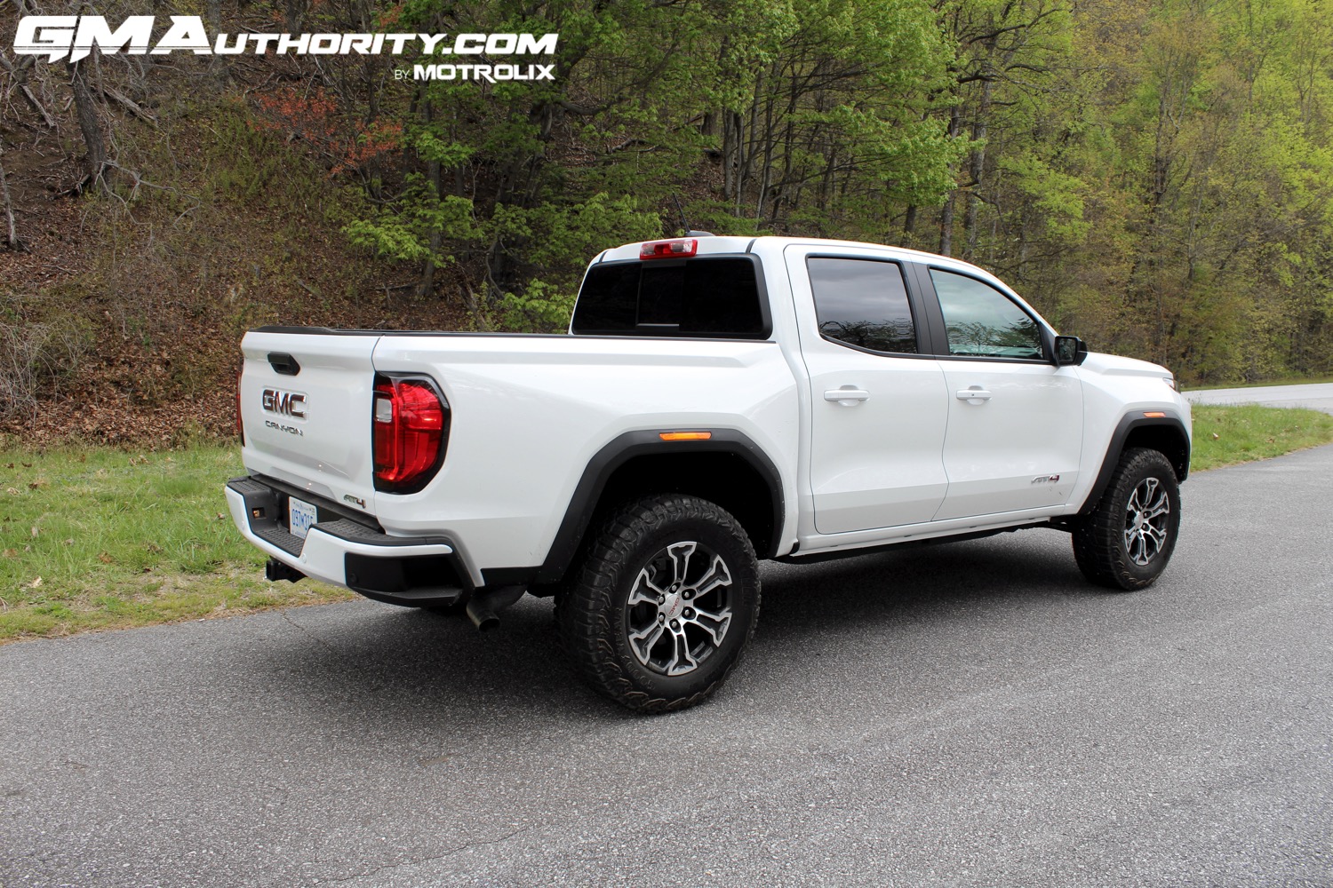 2023-gmc-canyon-at4-summit-white-gaz-first-drive-exterior-015-side-rear-three-quarters